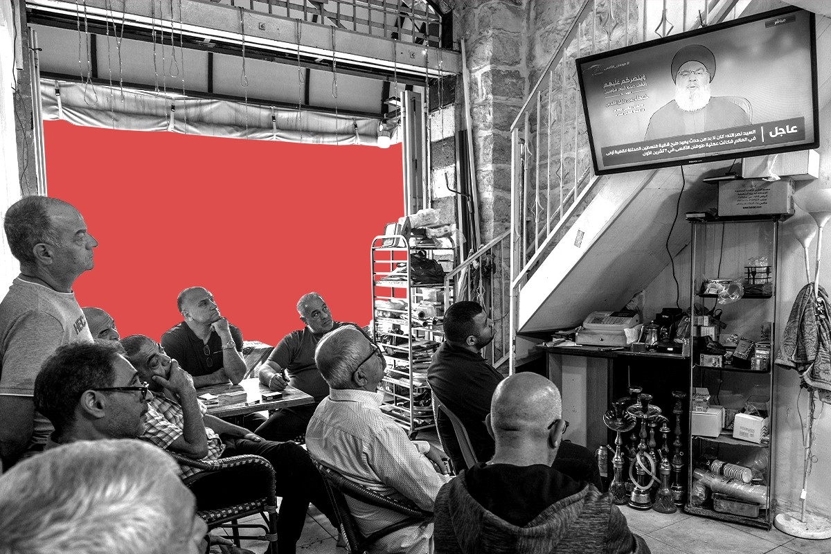 People watching Hassan Nasrallah on television.