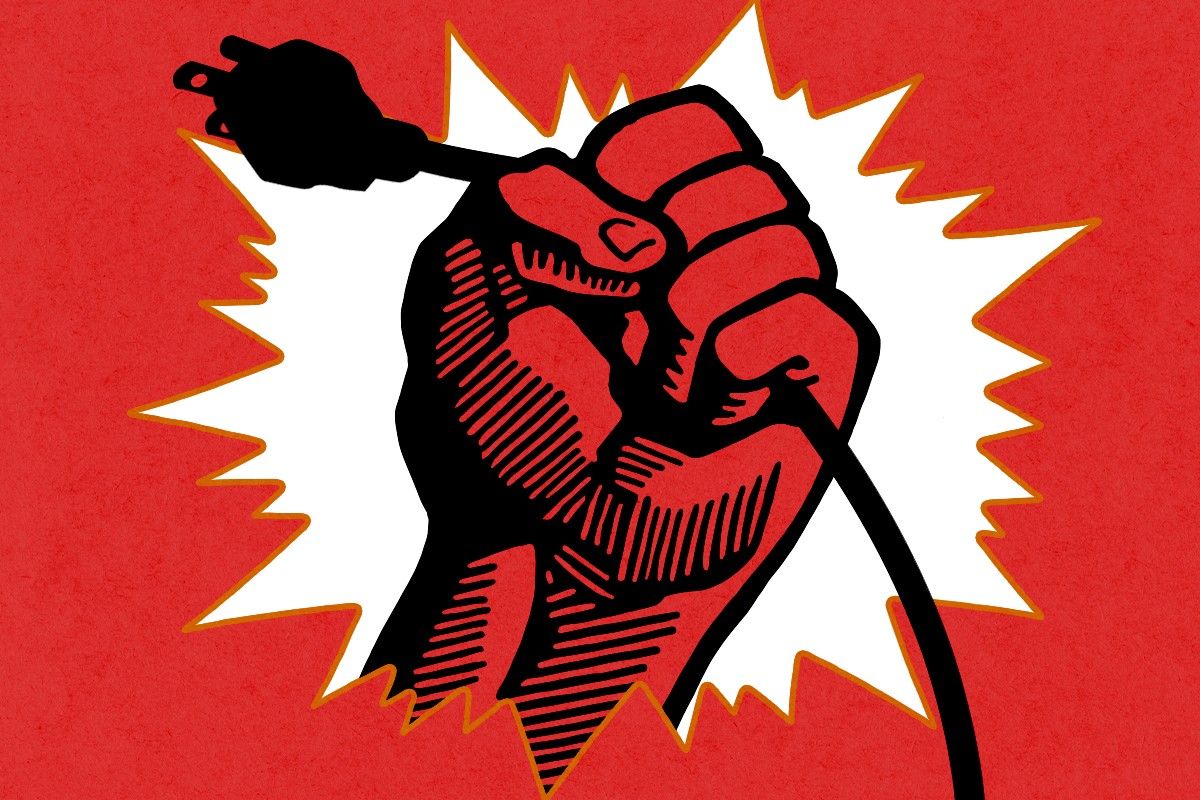 A fist holding a power cord.
