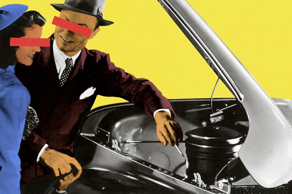 A car salesman showing off an engine.