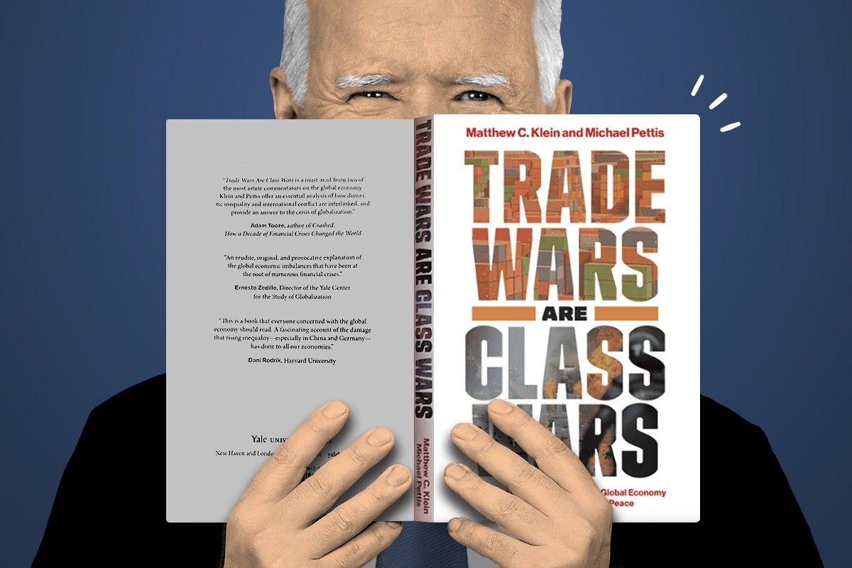 President Biden behind a copy of Trade Wars Are Class Wars.