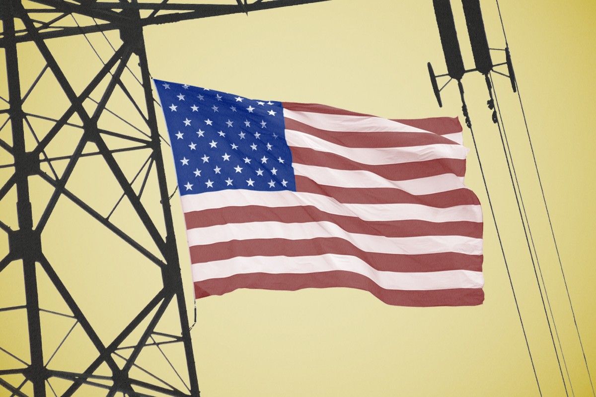 An American flag and power lines.
