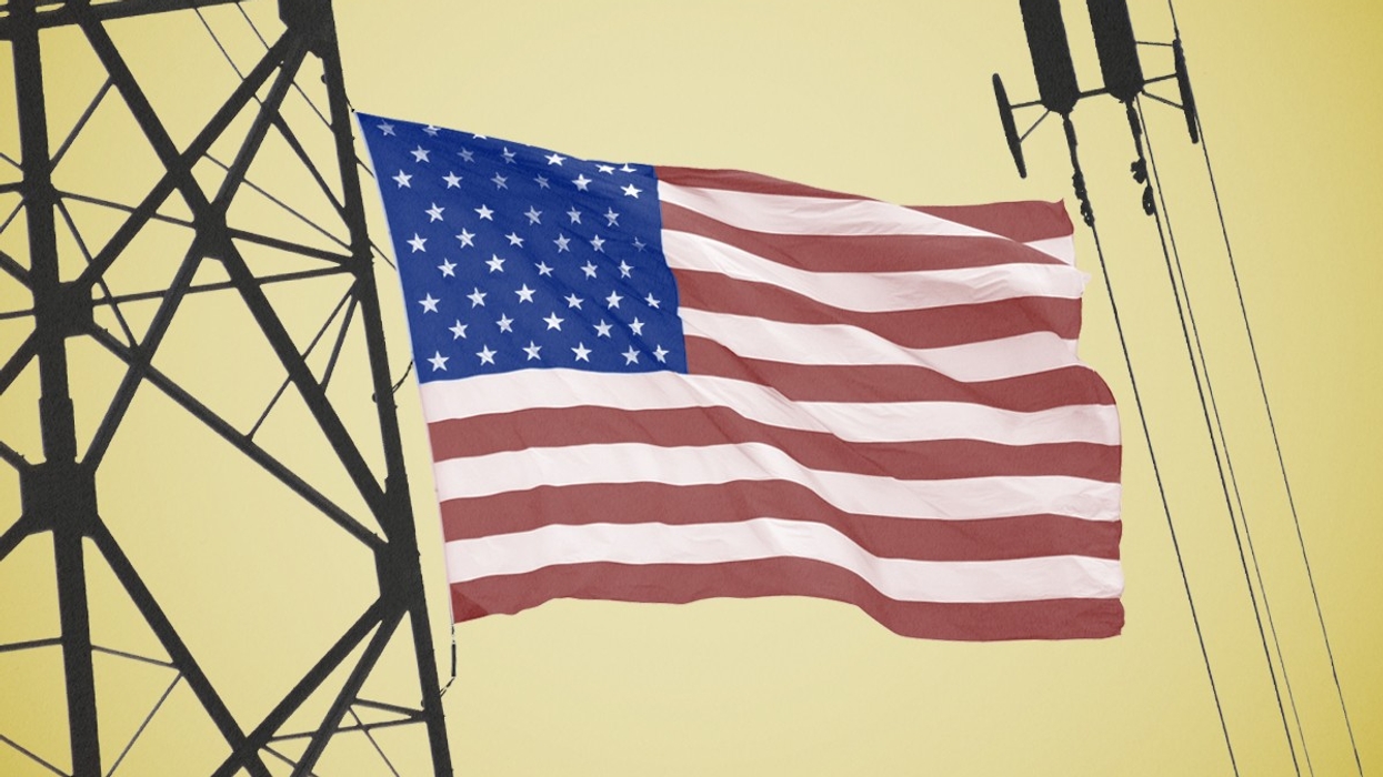 An American flag and power lines.