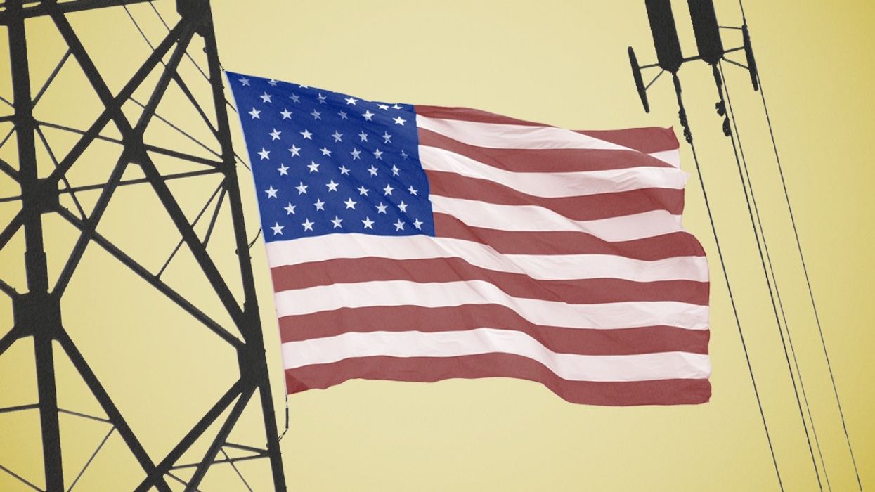 An American flag and power lines.