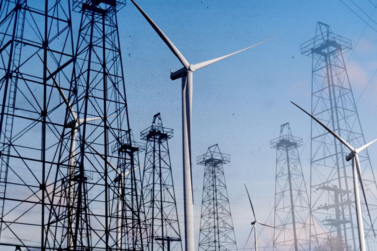 Oil derricks and wind turbines.