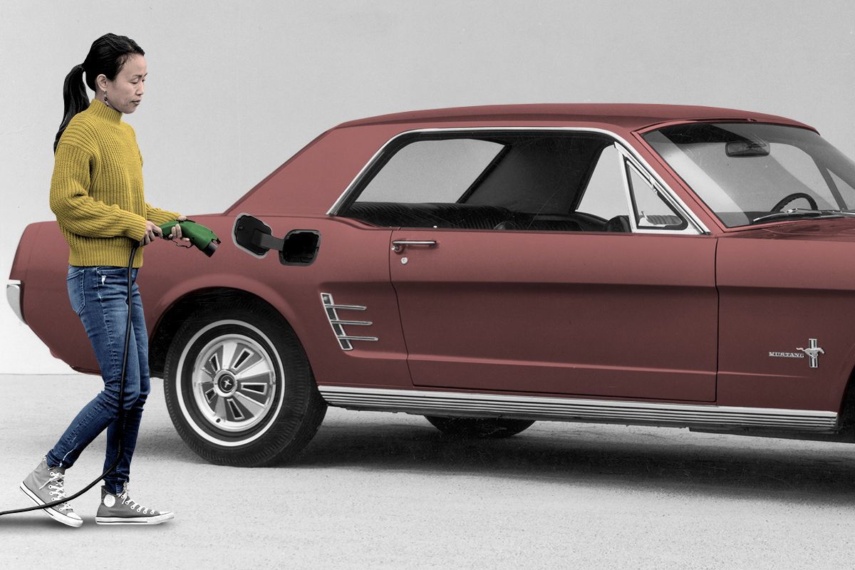 A woman charging a Mustang.