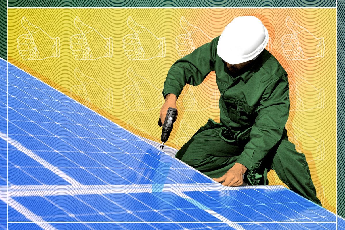 A worker installing solar panels.