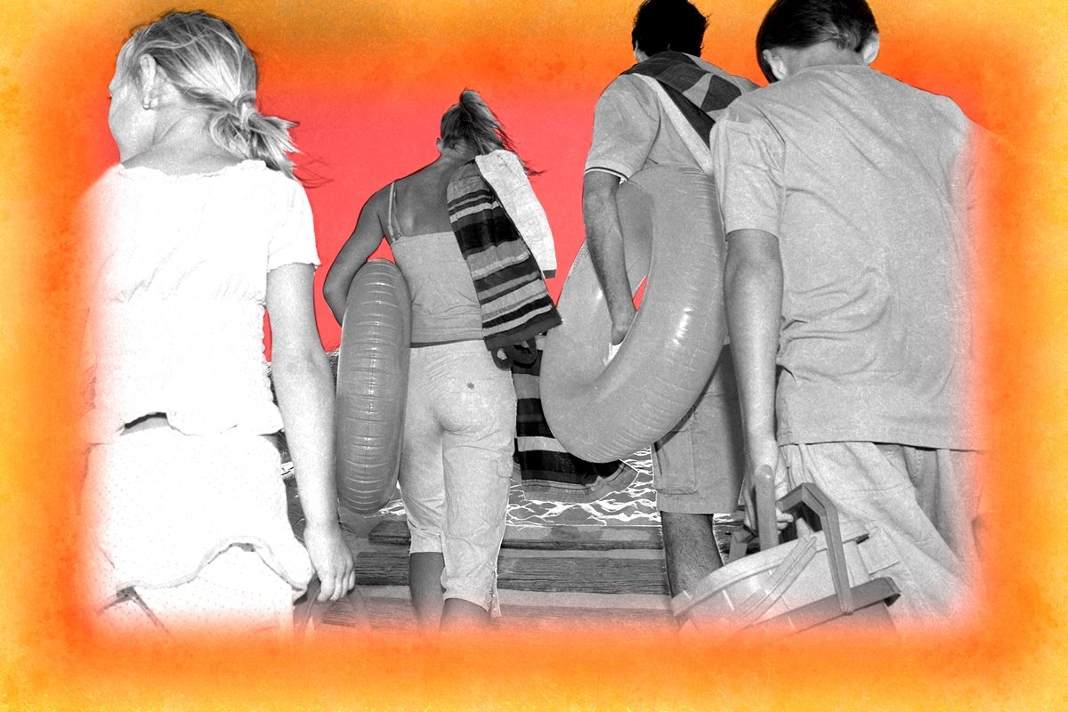 A family leaving the beach.