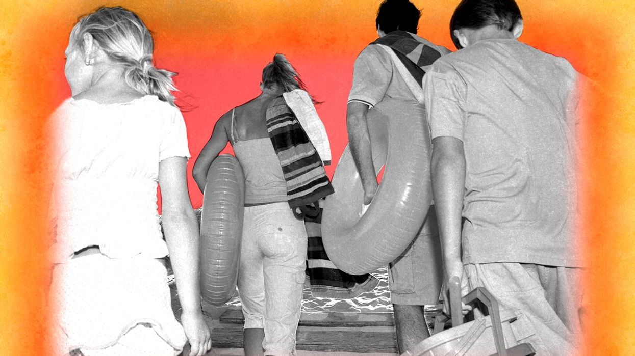 A family leaving the beach.