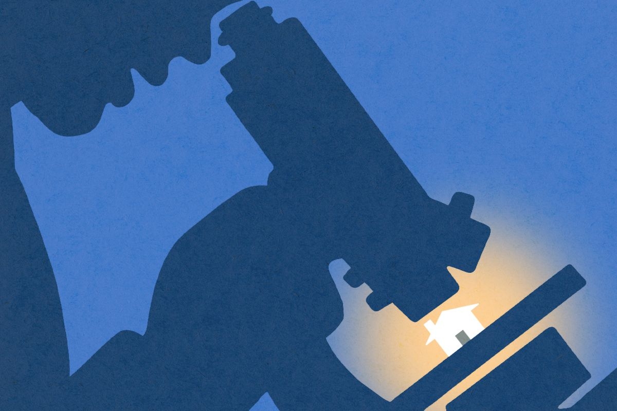 A scientist looking at a house with a microscope.