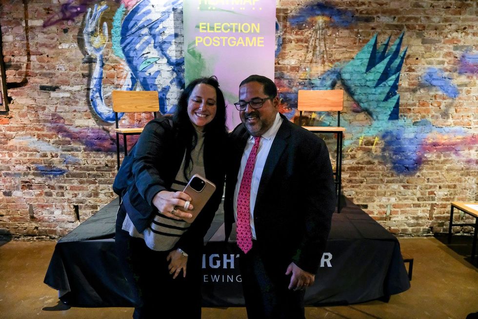 Neil Chatterjee and an event guest.