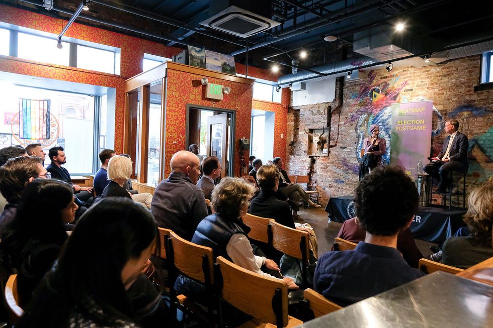 Jael Holzman and John Hickenlooper.