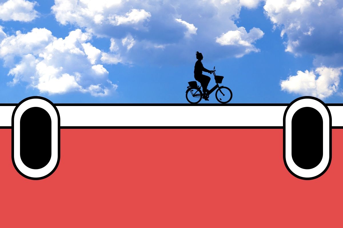 A bike rider on Rivian headlights.