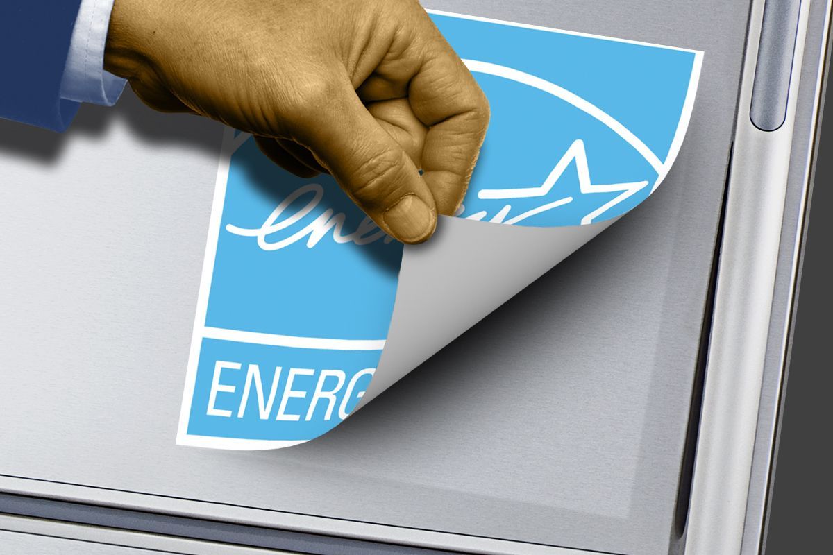 Peeling off an Energy Star sticker.