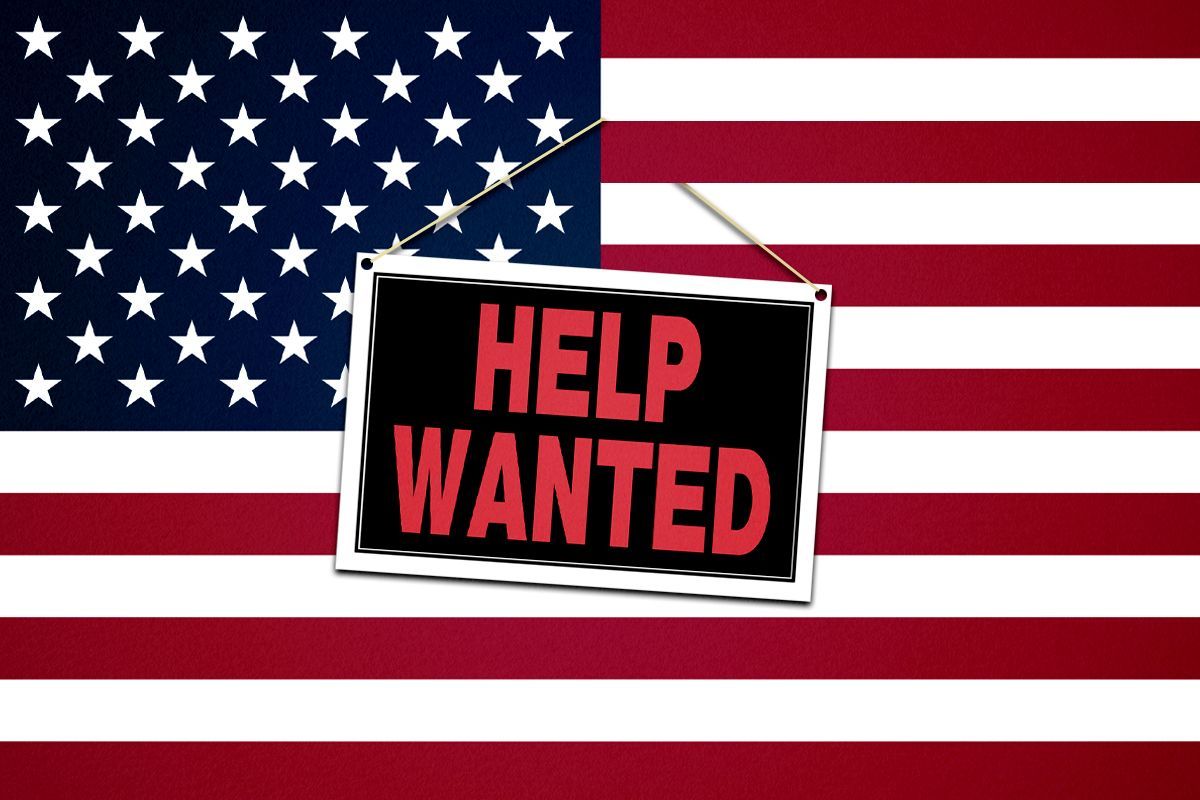 A Help Wanted sign on an American flag.