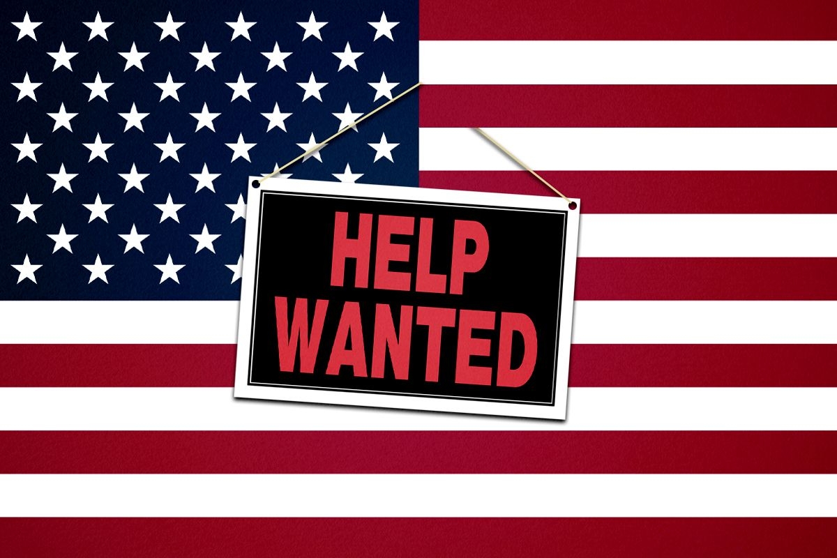 A Help Wanted sign on an American flag.