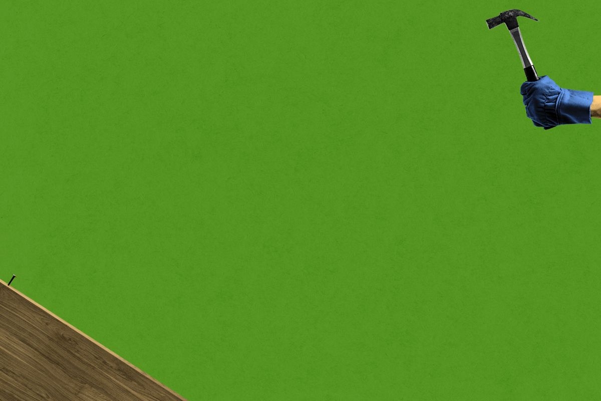 A hammer and nail far from each other.