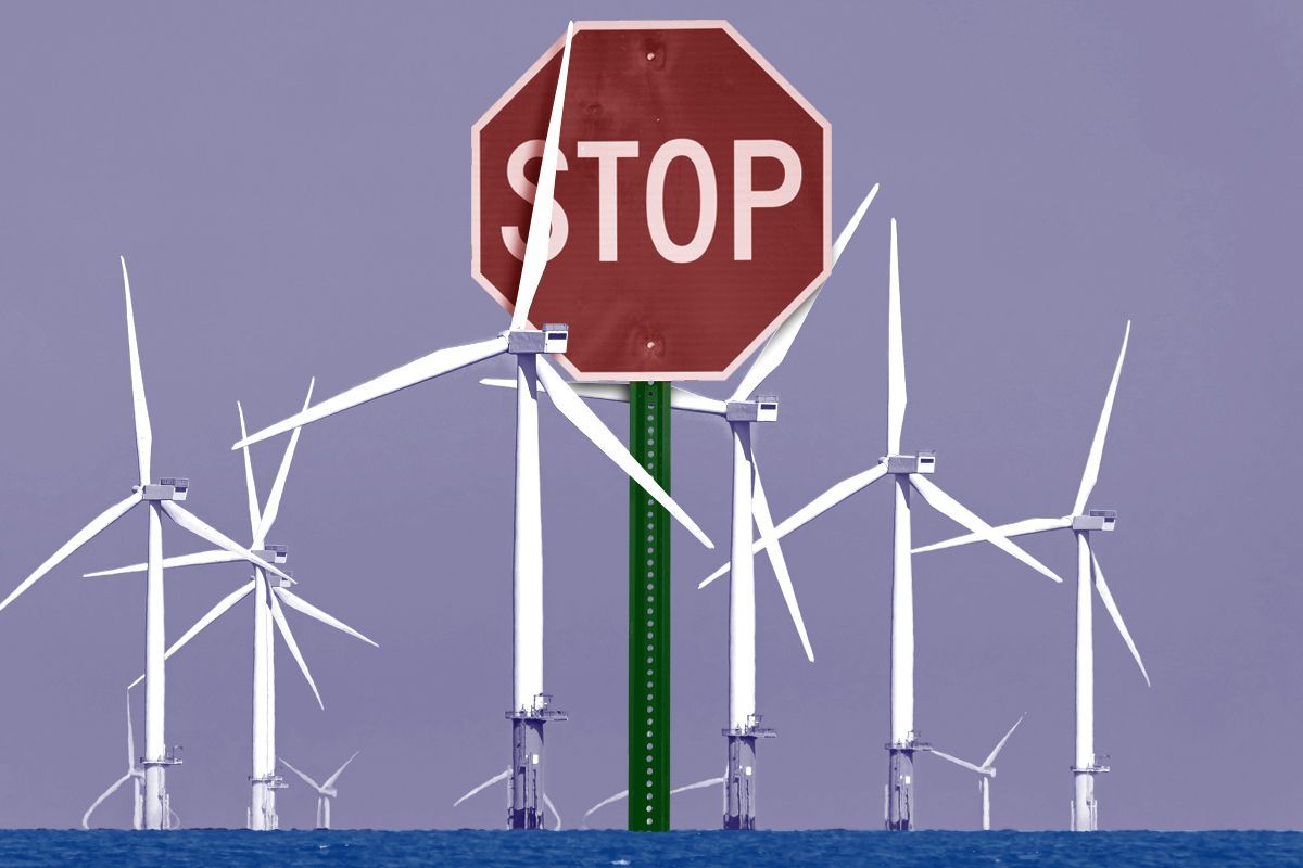 Wind turbines and a stop sign.