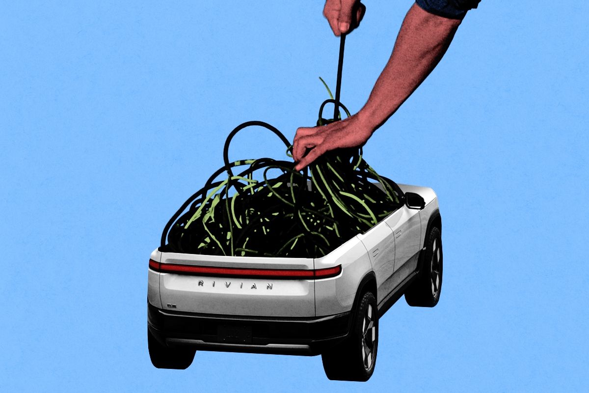 A Rivian having its wires pulled out. 