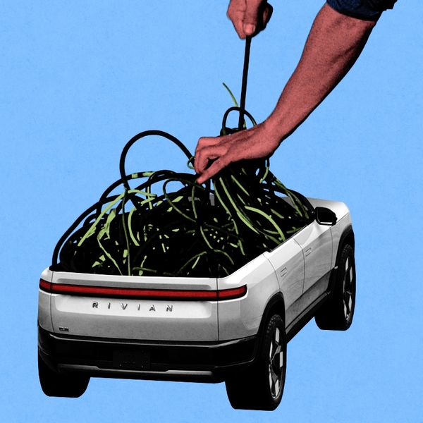 A Rivian having its wires pulled out.