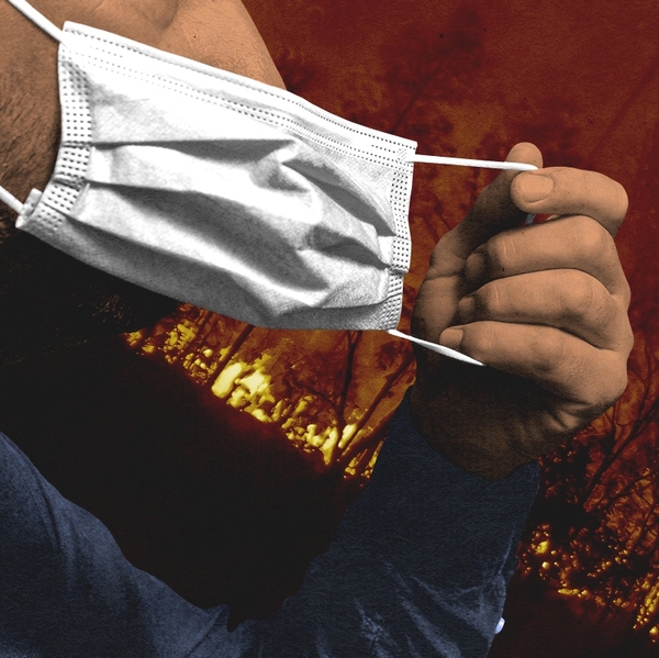 Taking off a mask during a wildfire.