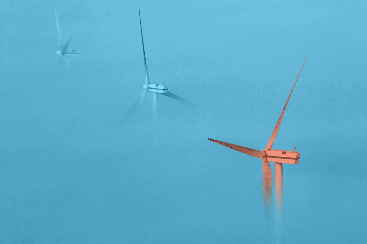 Wind turbines in fog.