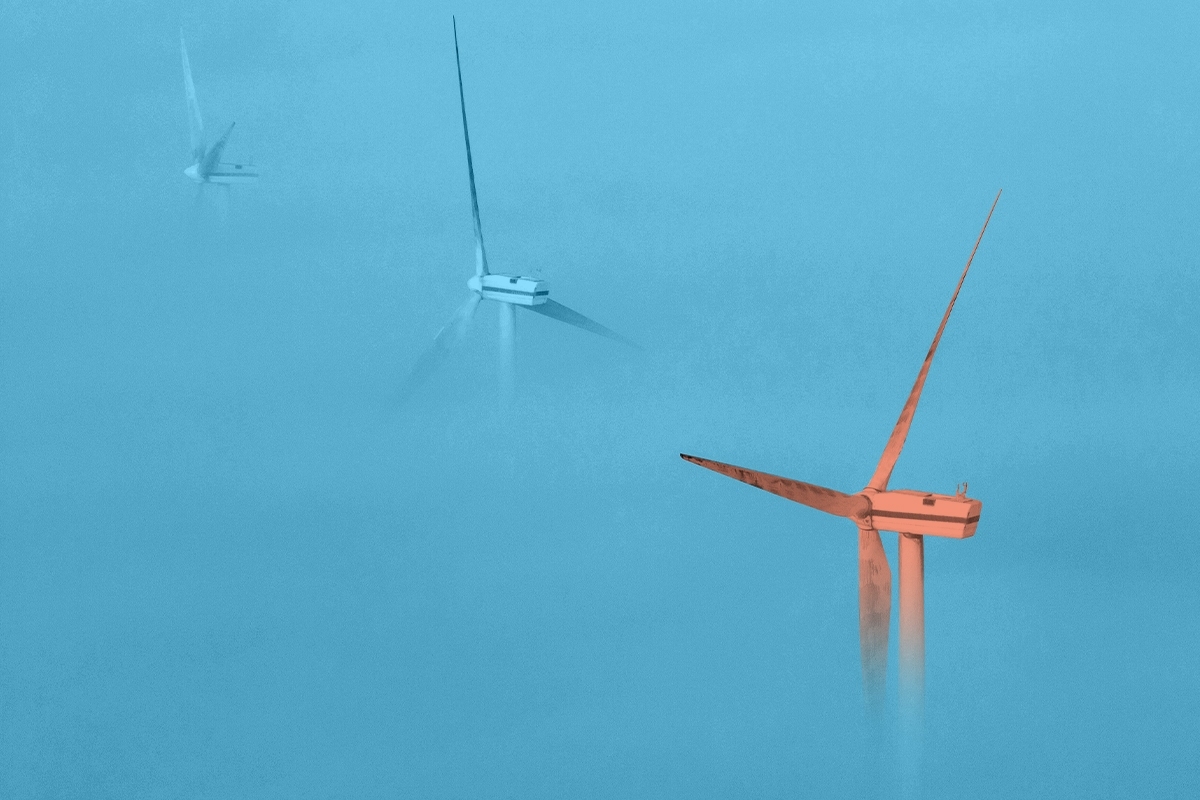 Wind turbines in fog.