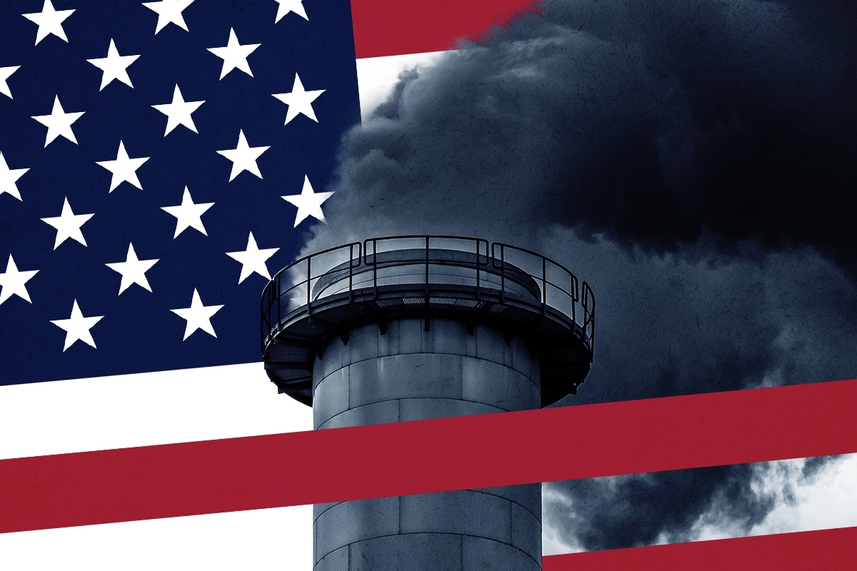 An American flag and a smokestack.