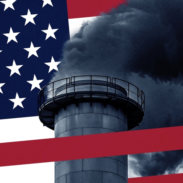 An American flag and a smokestack.