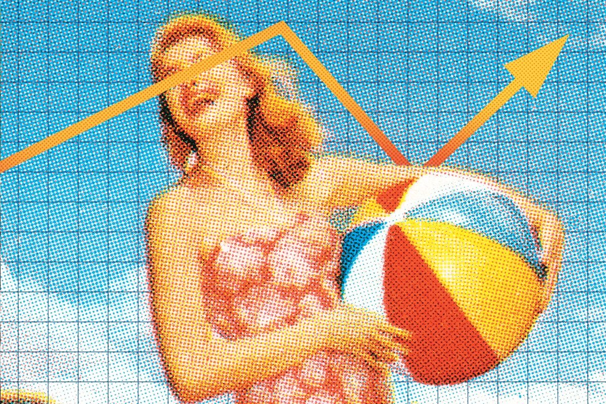 A woman holding a beach ball.