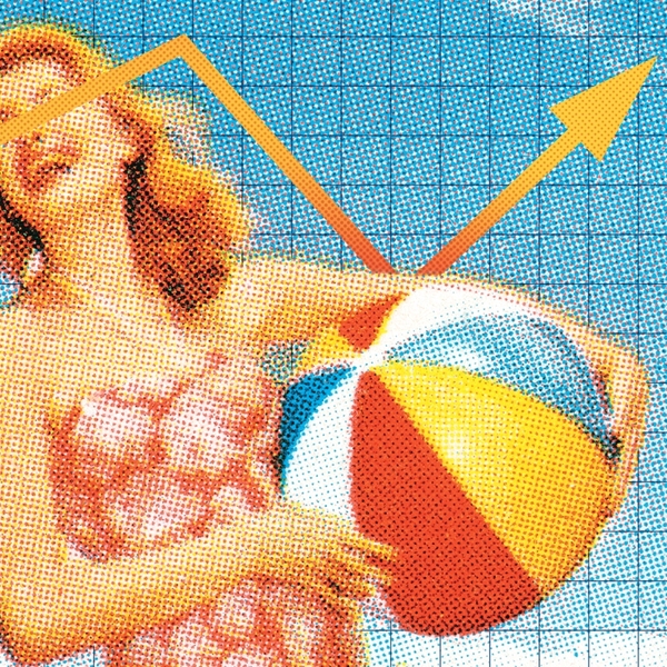 A woman holding a beach ball.