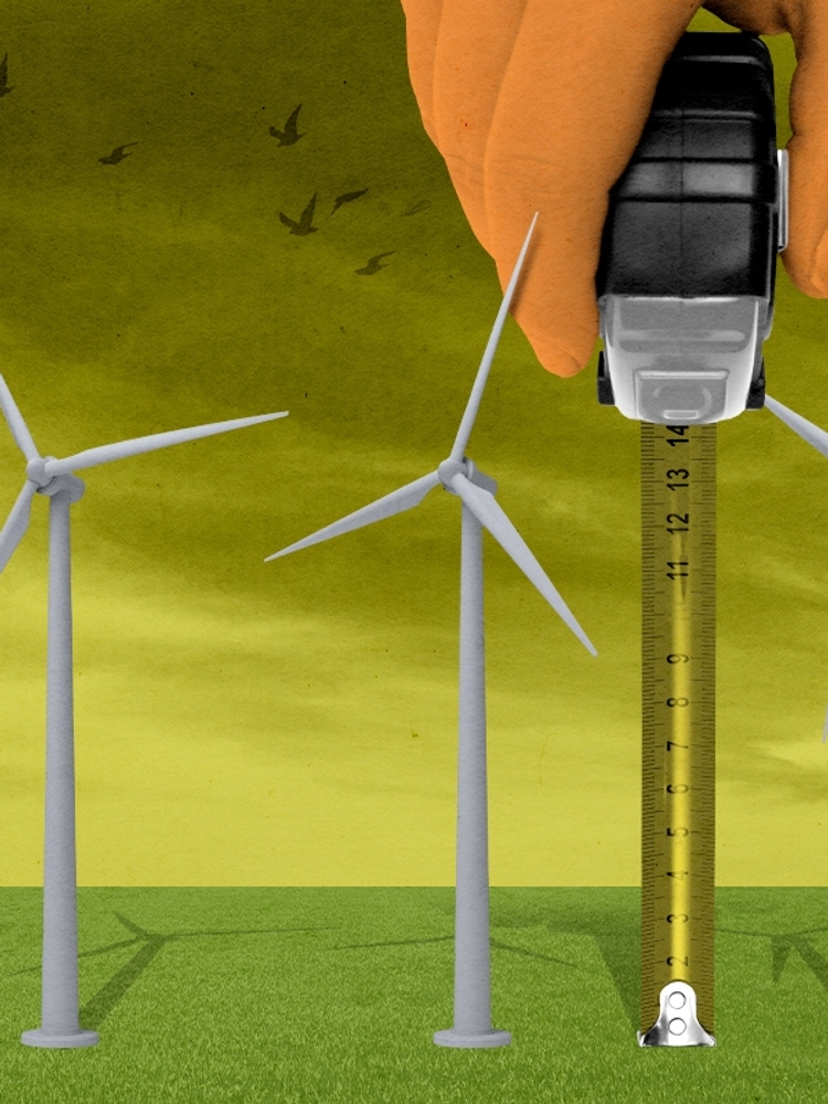 Trump measuring wind turbines.