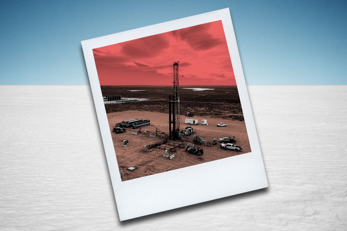 Oil rig photo on snowy backdrop.