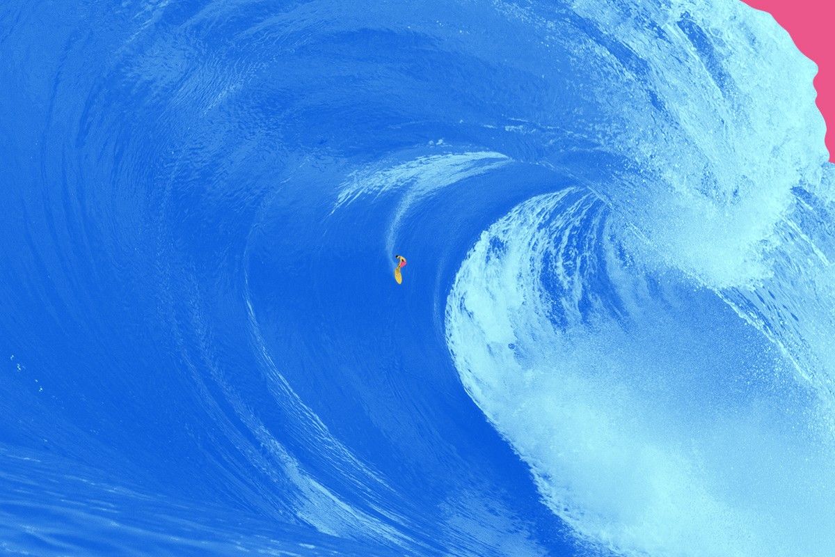 A surfer and a very large wave.