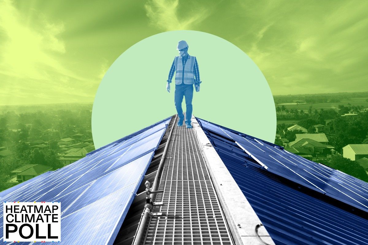 A worker installing solar panels.