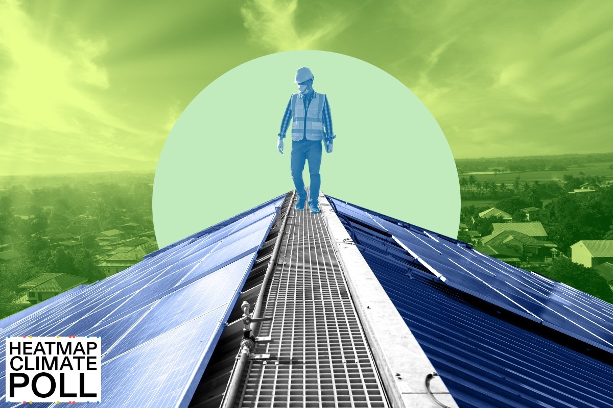 A worker installing solar panels.