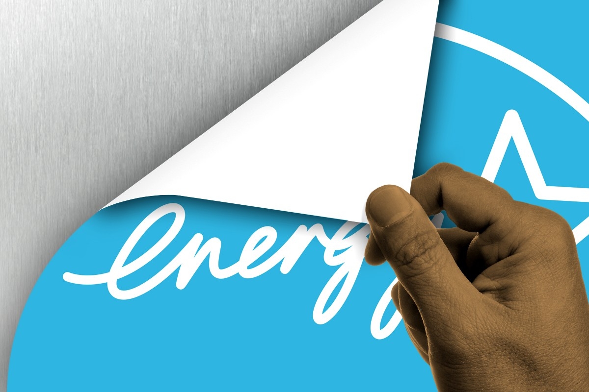 An Energy Star label being peeled off.