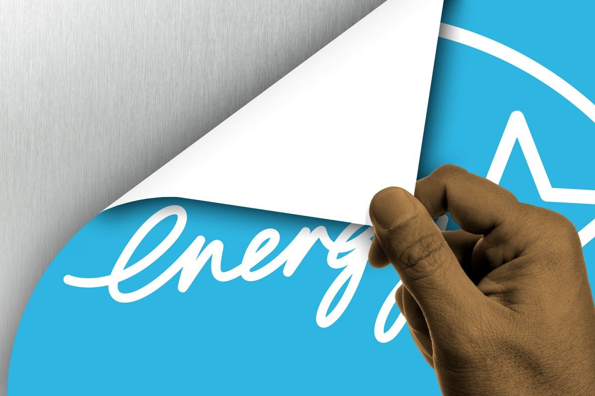 An Energy Star label being peeled off.