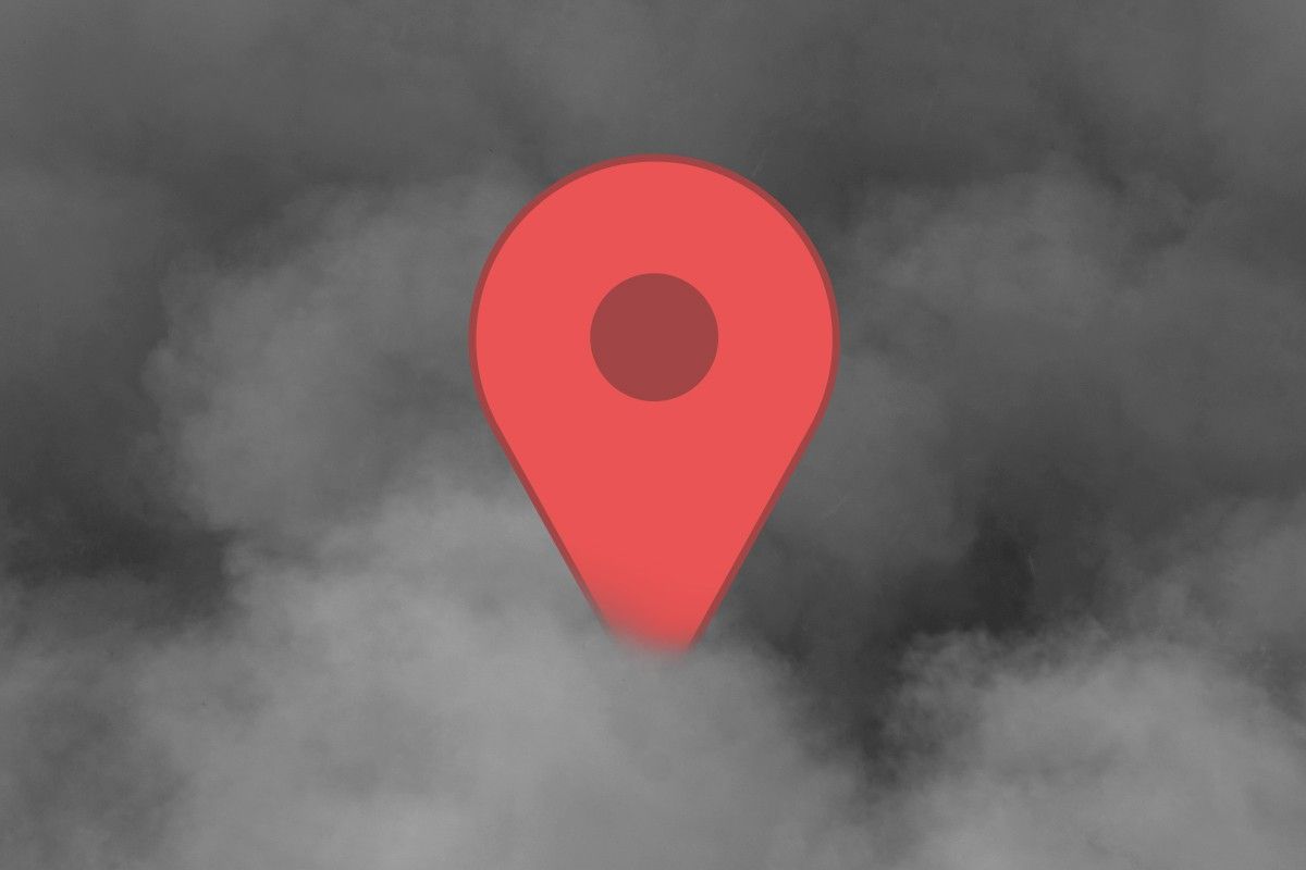 A location pin in smoke.