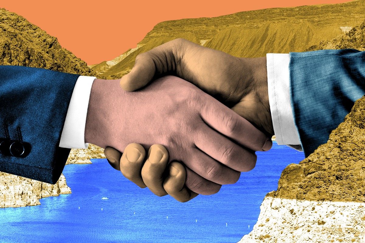 A handshake and the Colorado River.