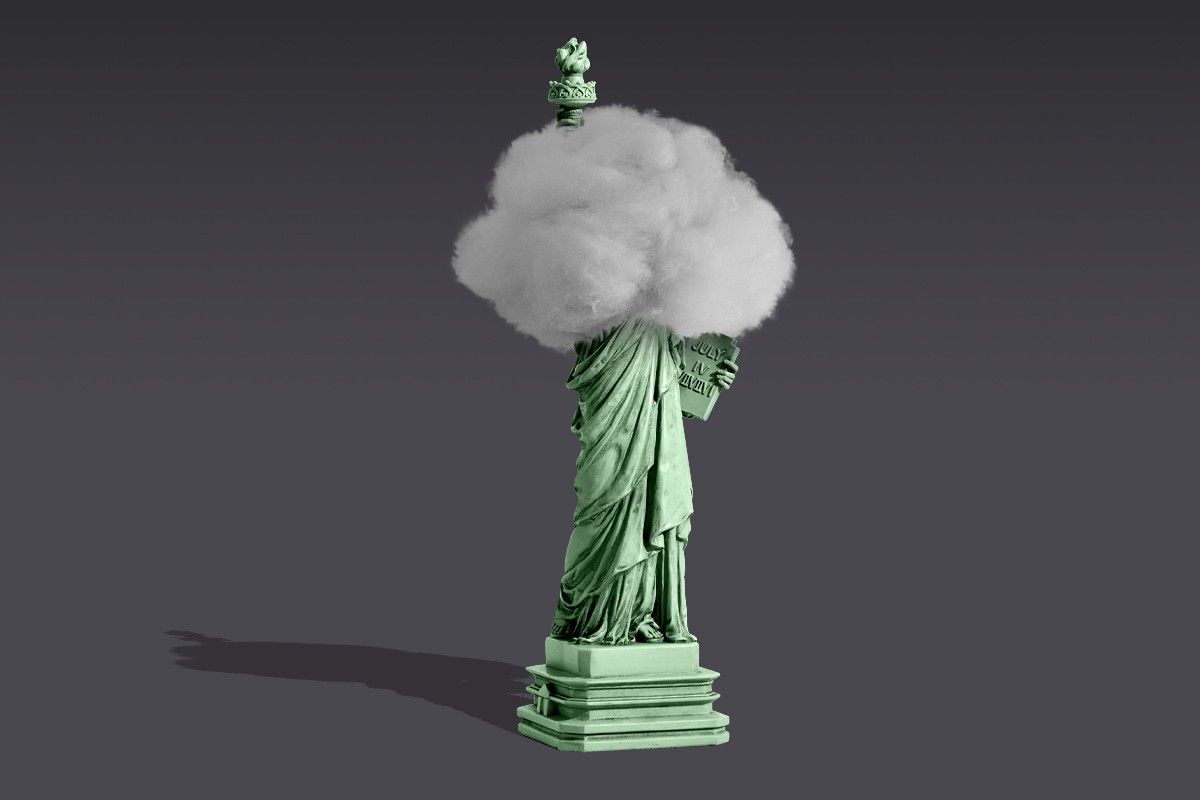 The Statue of Liberty with a cotton ball on its head.