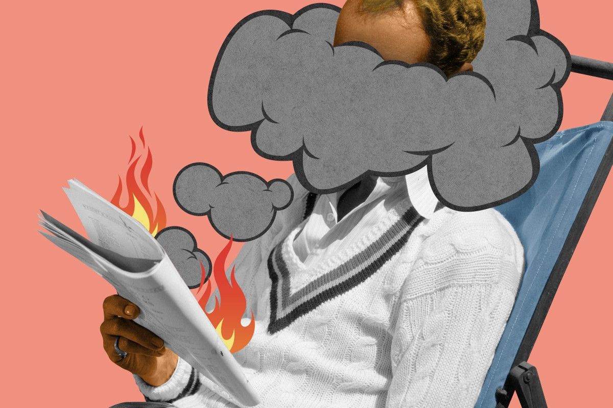 A man reading a smoky magazine.